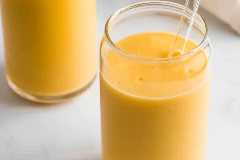Jackfruit smoothie in a clear glass with a clear straw vegan drinks.