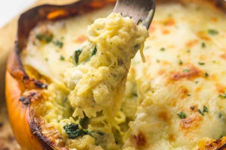 Cheesy spaghetti squash with spinach fall dishes for dinner.