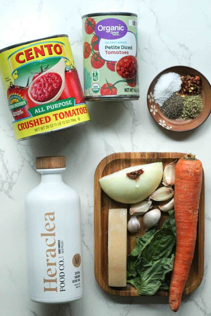 Marinara sauce ingredients: Heraclea olive oil, carrot, parmesan rind, basil, garlic, onion, diced tomatoes, crushed tomatoes, seasonings.
