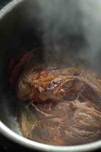 Chuck roast being seared in the instant pot.